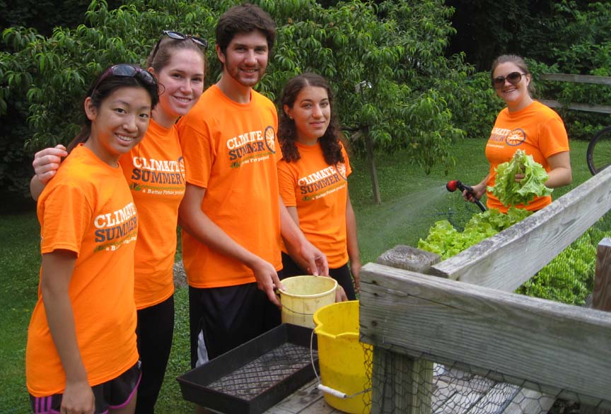 Climate Summer Volunteers washing lettuce